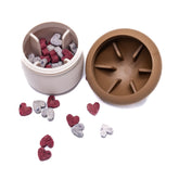 Opened Mushroom Dog Treat Dispenser showing interior compartments filled with treats promoting enrichment and puzzle play.